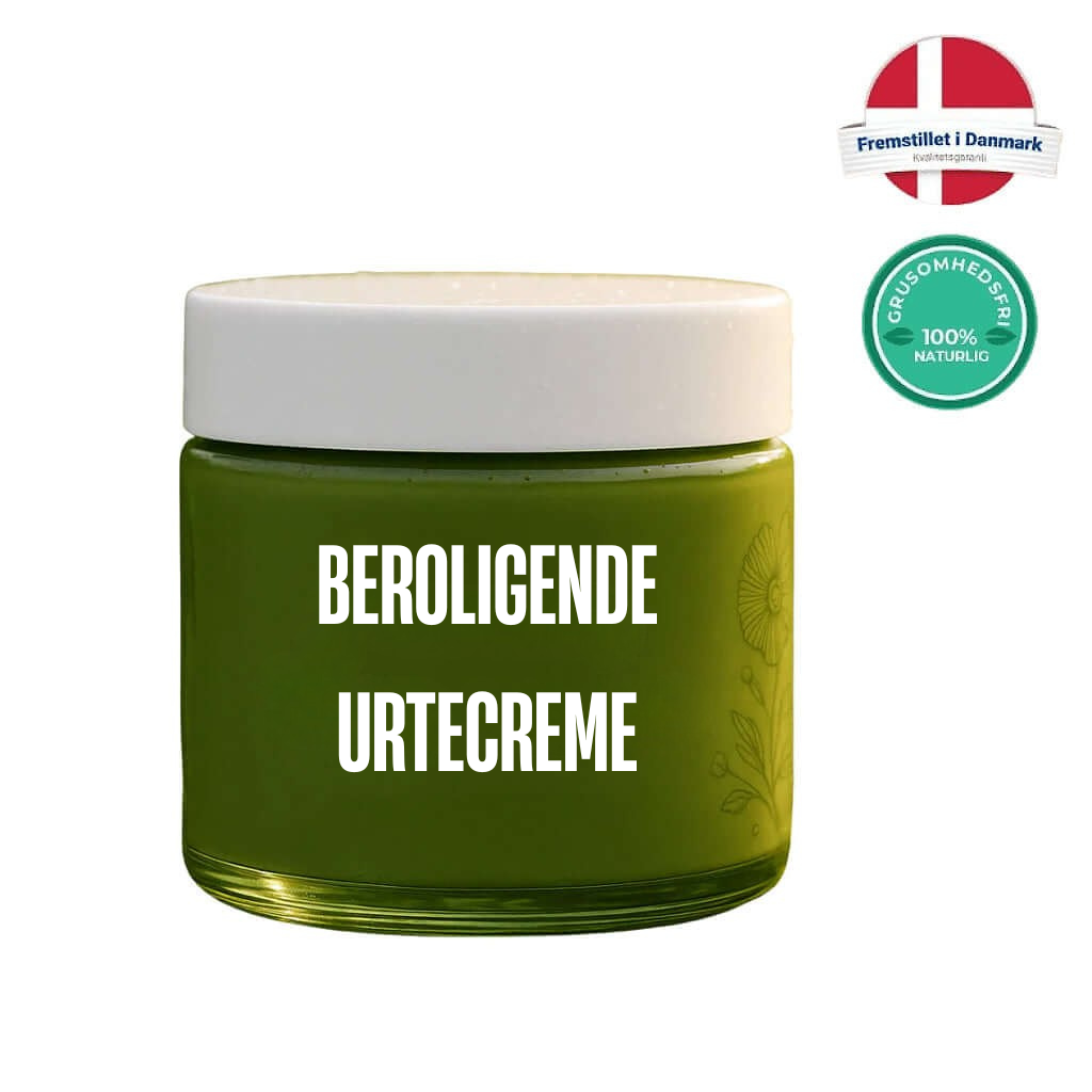Beroligende Urtecreme i grønt glas med hvidt låg, fremstillet med naturlige ingredienser.