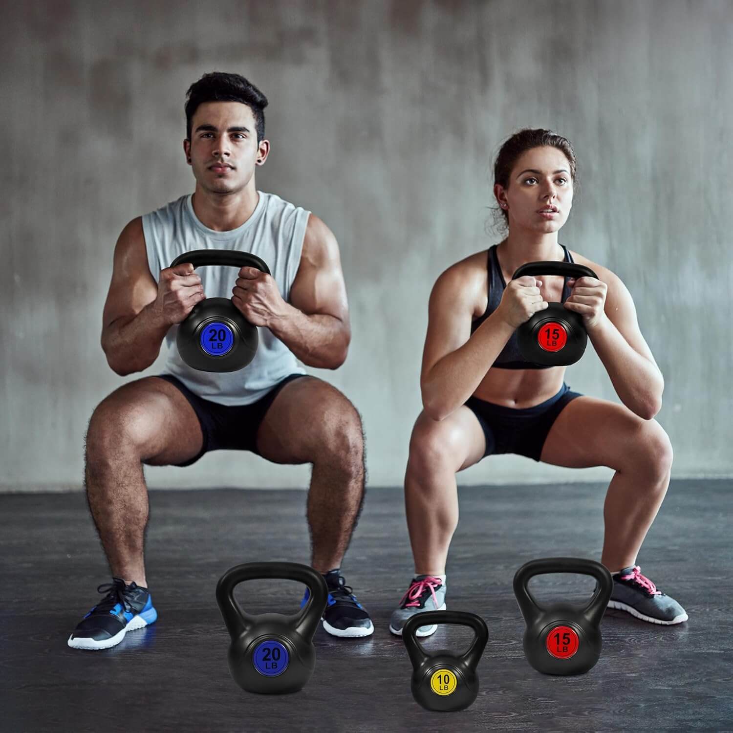 SKÖNHED PowerBell kettlebells used by a man and woman for strength training in a gym.
